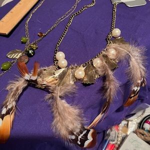 2 leaf and feather necklaces